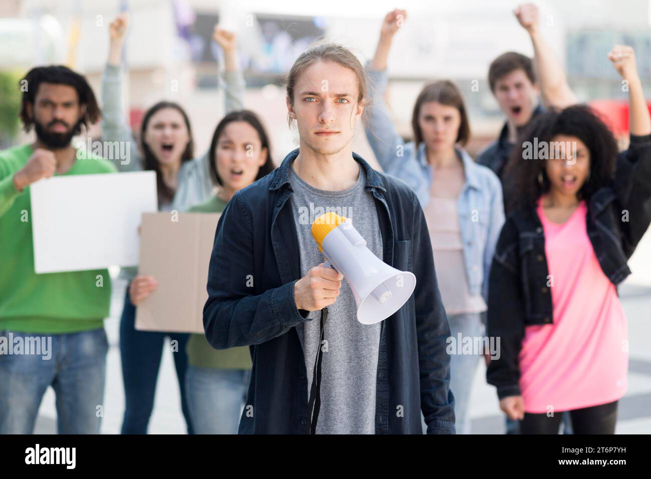 Group people protesting using megaphones Stock Photo