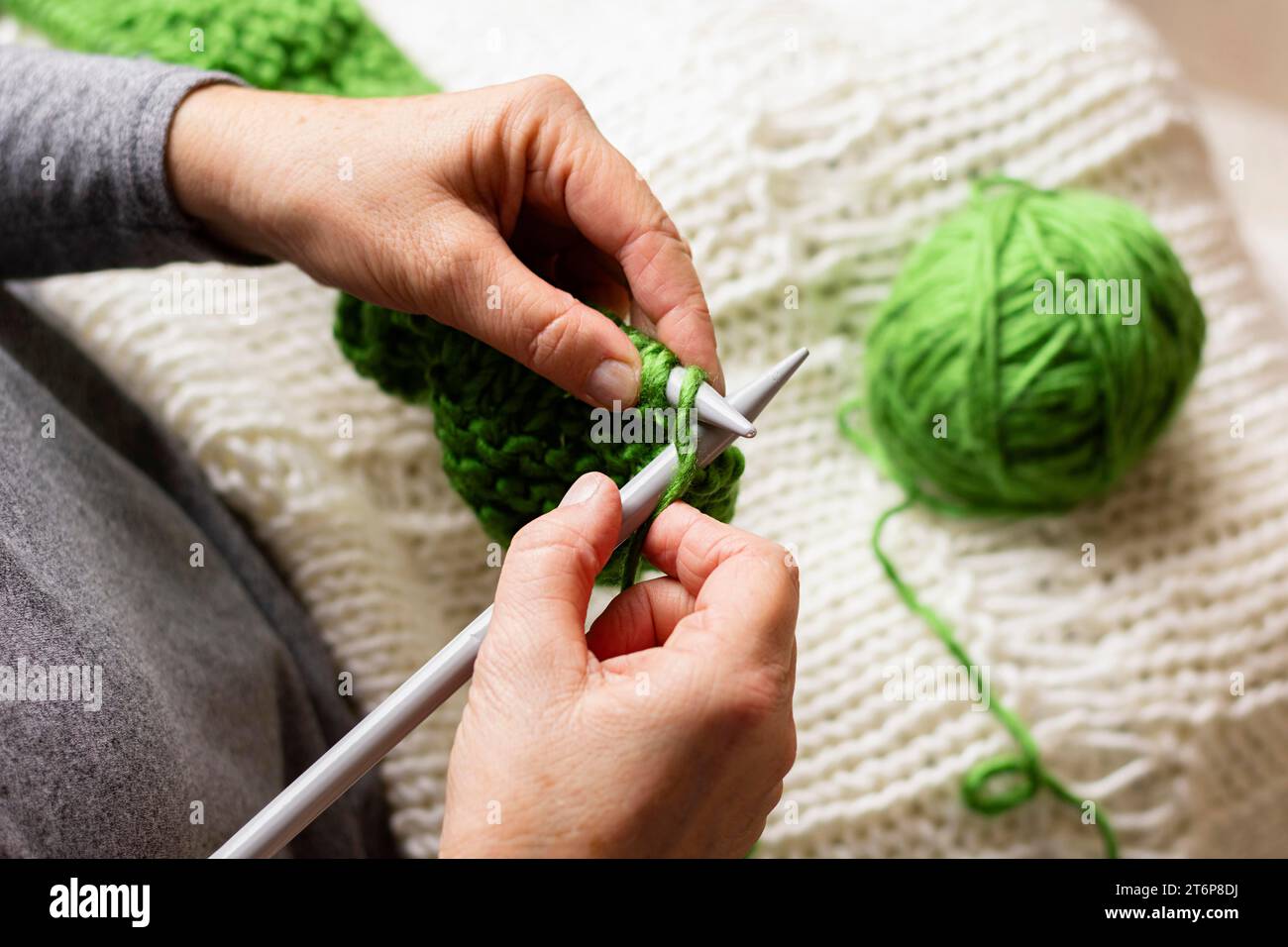 Knitting Using Thread Green thread movement hi-res stock photography and images - Alamy