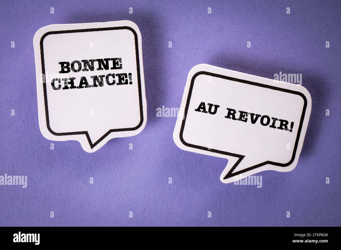 Goodbye and Good Luck in French. Text on speech bubbles. Purple background Stock Photo Alamy