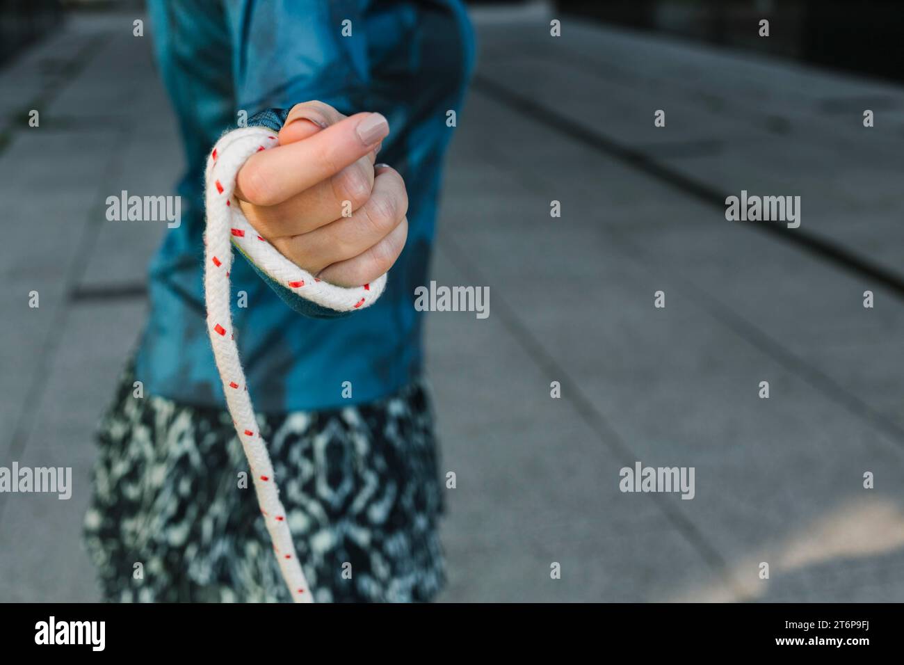 Side view woman holding jump rope Stock Photo - Alamy