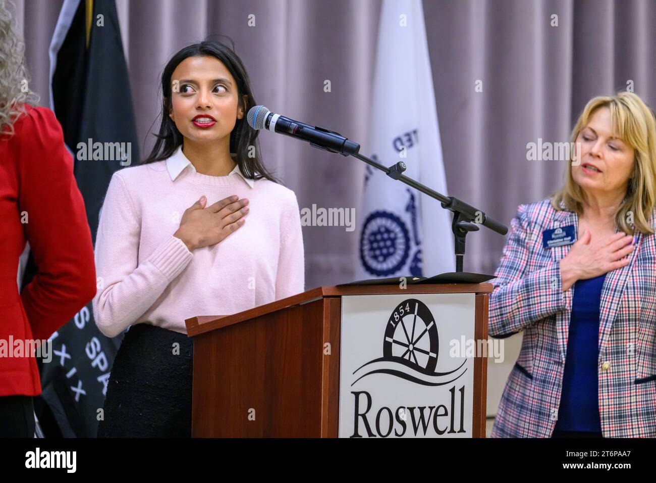 November 11, 2023, Roswell, Georgia, United States: SHIBANI CHAKRABARTY, Outreach Director for Office of Senator John Ossoff, leads the Pledge of Allegiance as residents gather at Roswell Area Park gymnasium to honor U.S. armed forces veterans on Nov. 11, celebrating Veterans Day. The annual event is a heartfelt expression of gratitude to those who have served their country with honor and dedication. Veterans Day, observed as a federal holiday since 1954, was formerly known as Armistice Day, commemorating the end of World War I. Photo by: Stanley Leary/ZUMA Press (Credit Image: © Stanley Leary Stock Photo