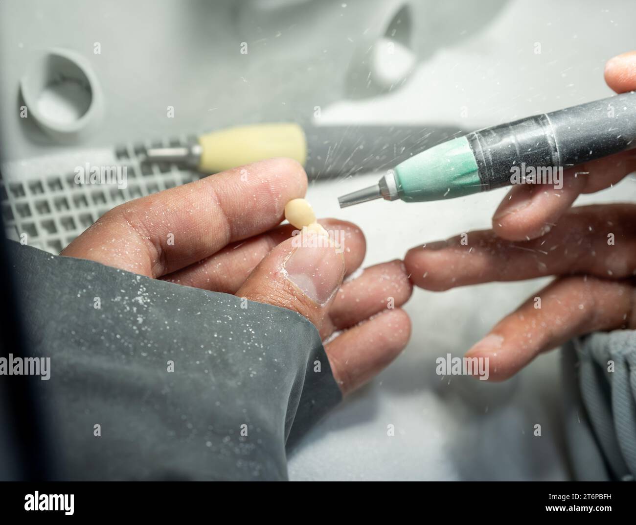 Sanding human tooth crowns to be fit and suitable for human needs Stock