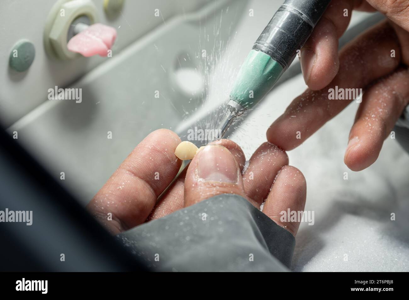 Sanding human tooth crowns to be fit and suitable for human needs Stock