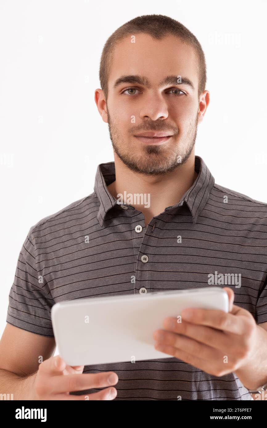 Technology aids the concentrated effort of this composed man Stock Photo