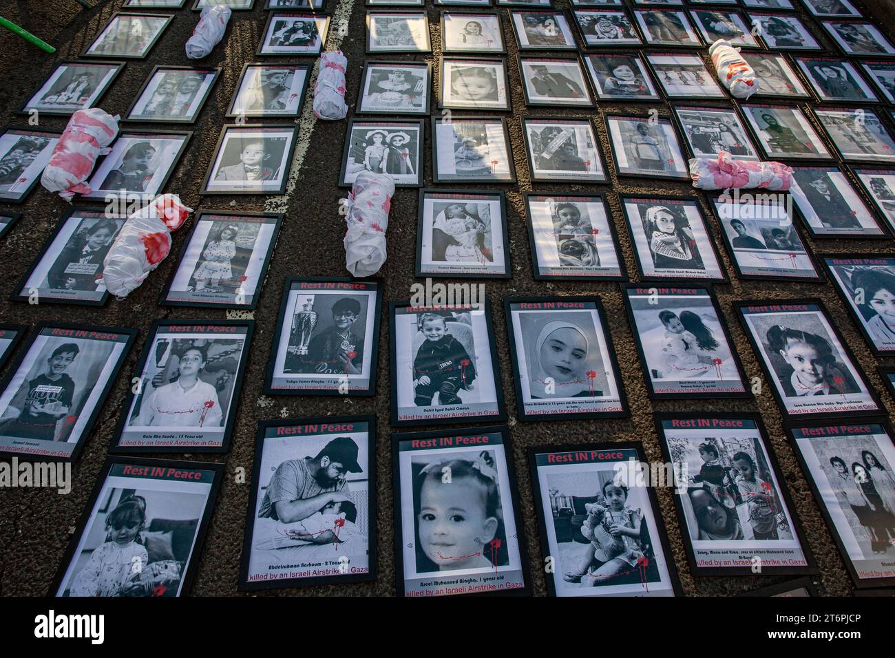 11th November 2023. London, UK.Pictures of children killed in Gaza placed by protesters outside Nine Elms on Armistice Day calling for an immediate ceasefire in the Middle East, where thousands of innocent civilians including many children have died both in the Hamas attack on Israel and in hugely punitive air attacks which have devastated large areas of Gaza.Credit Image: © Horst Friedrichs Stock Photo