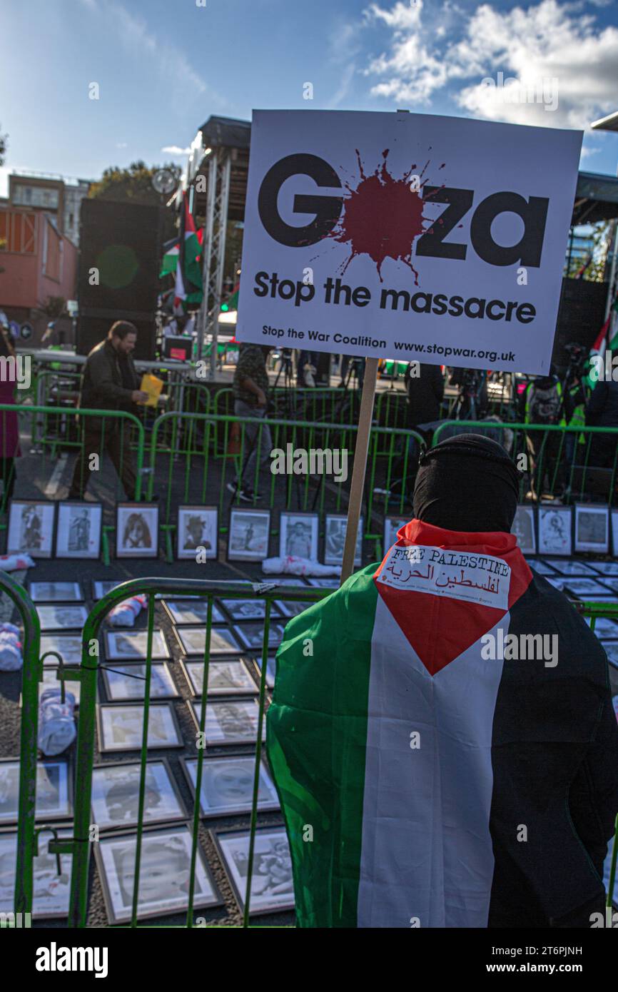 11th November 2023. London, UK.Pictures of children killed in Gaza placed by protesters outside Nine Elms on Armistice Day calling for an immediate ceasefire in the Middle East, where thousands of innocent civilians including many children have died both in the Hamas attack on Israel and in hugely punitive air attacks which have devastated large areas of Gaza.Credit Image: © Horst Friedrichs Stock Photo