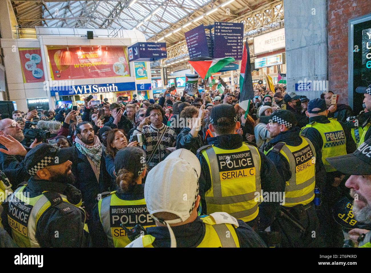 London, UK. 11th Nov 2023. Michael Gove was harrassed at Victoria Station during the Palestine Protest and is followed by protesters out of the station; Police proceeded to protect him and lead him into a police van for escape Credit: Ehimetalor Unuabona/Alamy Live News Stock Photo