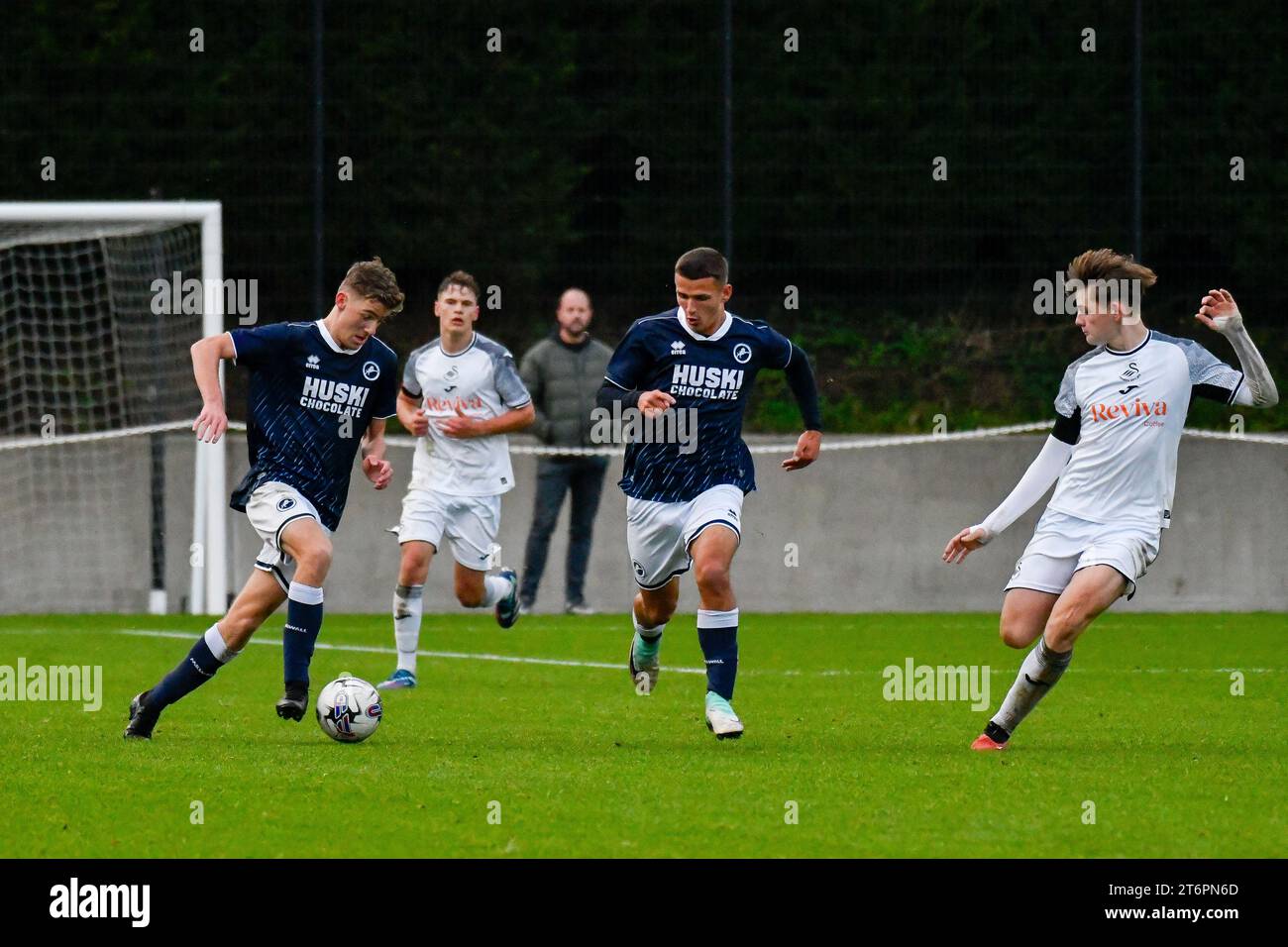 Swansea, Wales. 4 February 2023. Richard Faakye of Swansea City holds off  the challenge from Jack Howland of Millwall during the Professional  Development League game between Swansea City Under 18 and Millwall