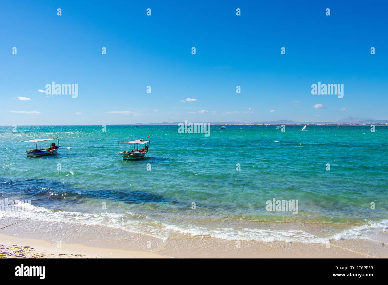 Hammamet Tunisia, Beach and boats on shallow water, view on Mediterranean sea Stock Photo