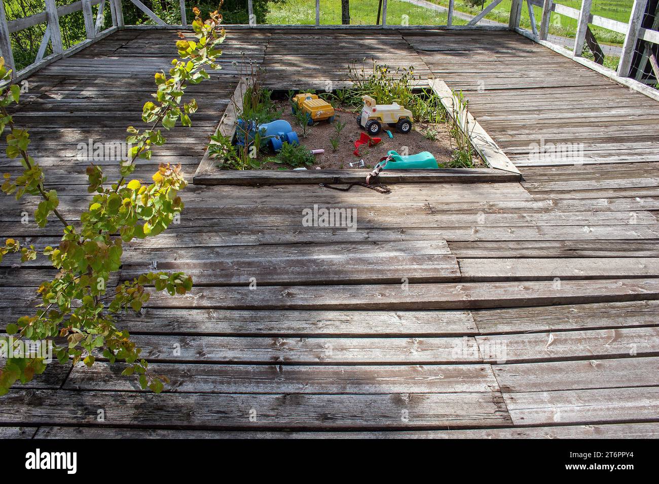 abandoned sandbox for children with forgotten toys Stock Photo