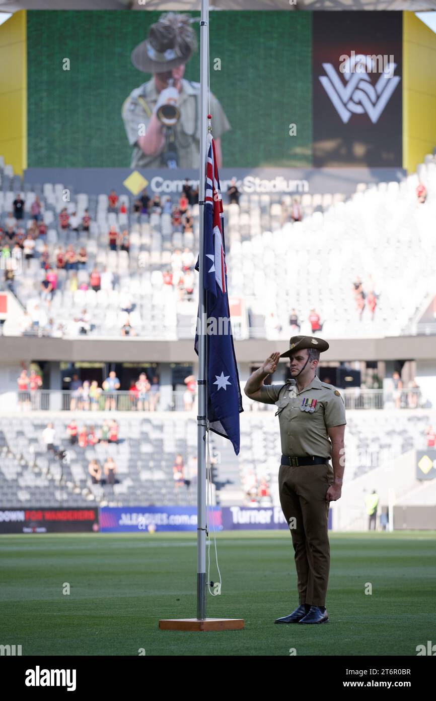 Australian Army soldier salutes during a Remembrance Day service before the A-League Men Rd4 between the Wanderers and Perth Glory at CommBank Stadium on November 11, 2023 in Sydney, Australia Stock Photo