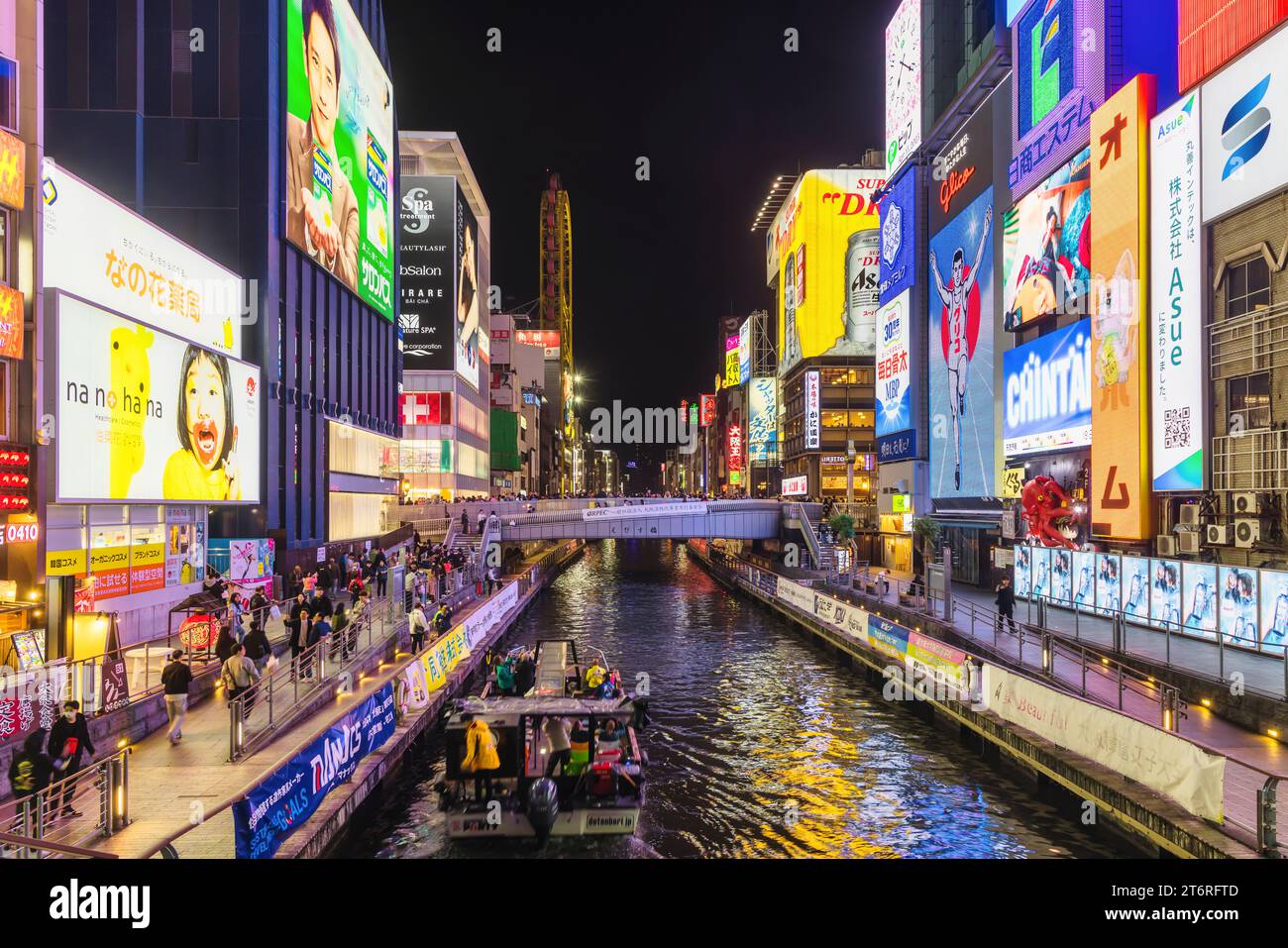 Osaka, Japan - April 13, 2023: Dotonbori area at the Dotonbori canal at night. Known as one of Osaka's principal tourist and nightlife areas, the area Stock Photo