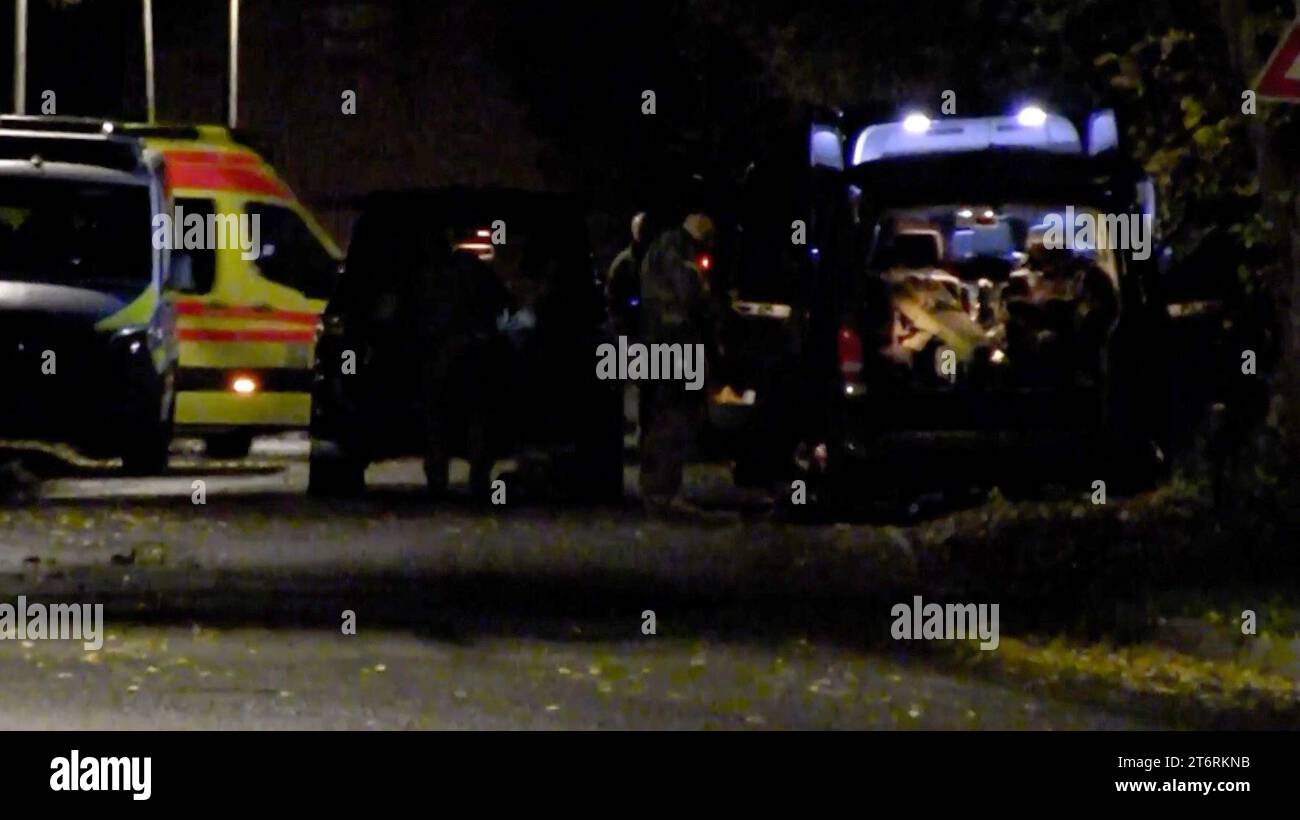 12 November 2023, Brandenburg, Vieritz: The video still shows police officers leaving the scene (best possible quality). After around 34 hours, a major police operation involving an armed man barricaded in a house in the Havelland district has come to an end. The suspect was found by the emergency services in the attic of the building in the municipality of Milower Land at around midnight on Sunday night, a police spokeswoman said. Photo: Christian Pörschmann/TNN/dpa Stock Photo