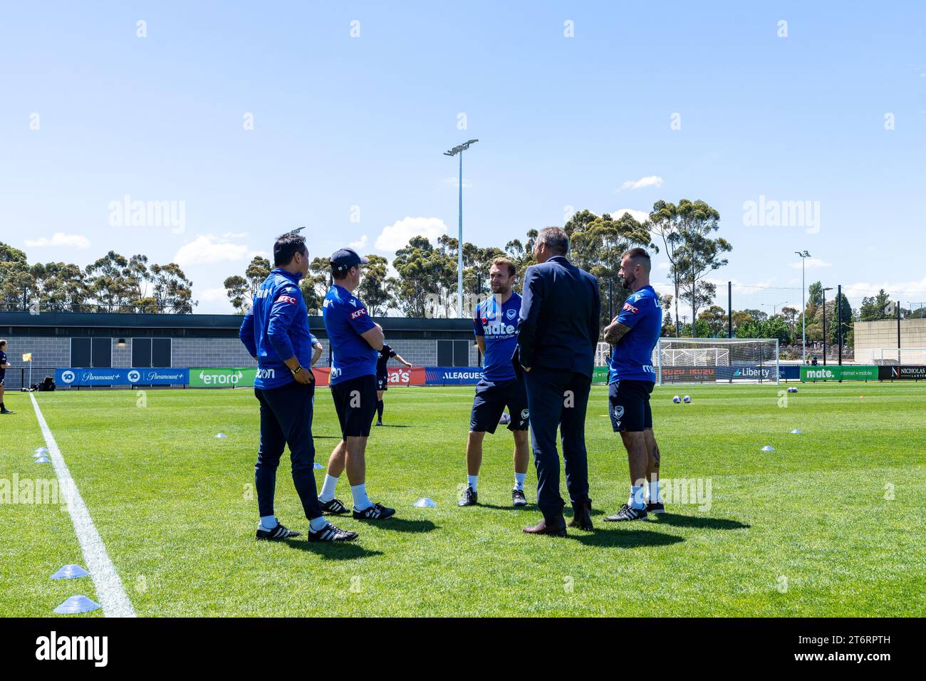 Bundoora, Australia. 12 November, 2023. Melbourne Victory Head Coach Jeff Hopkins and members of the support team inspect the pitch before the match. Credit: James Forrester/Alamy Live News Stock Photo