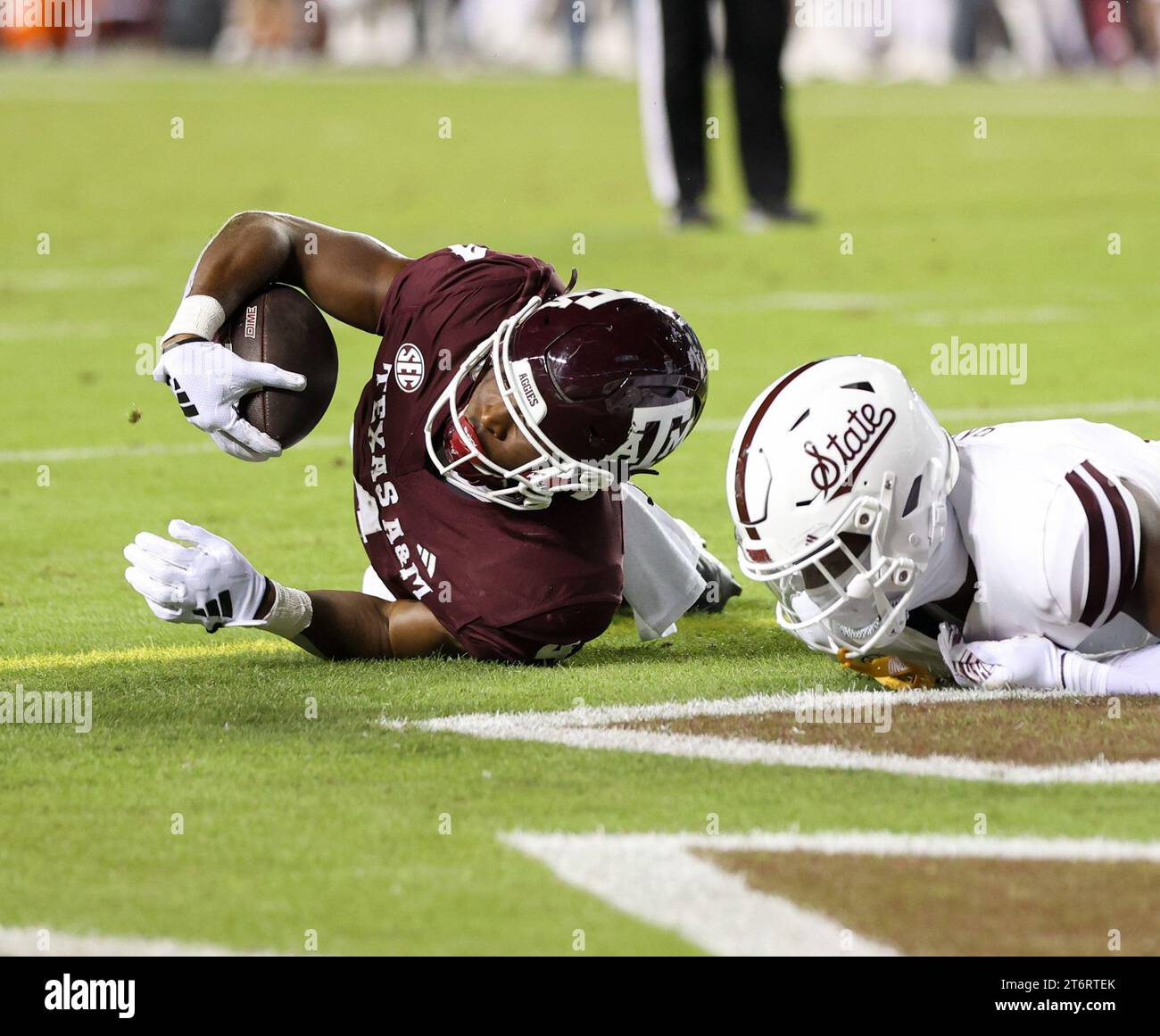 November 11, 2023 Texas A&M running back Amari Daniels (4) scores on a