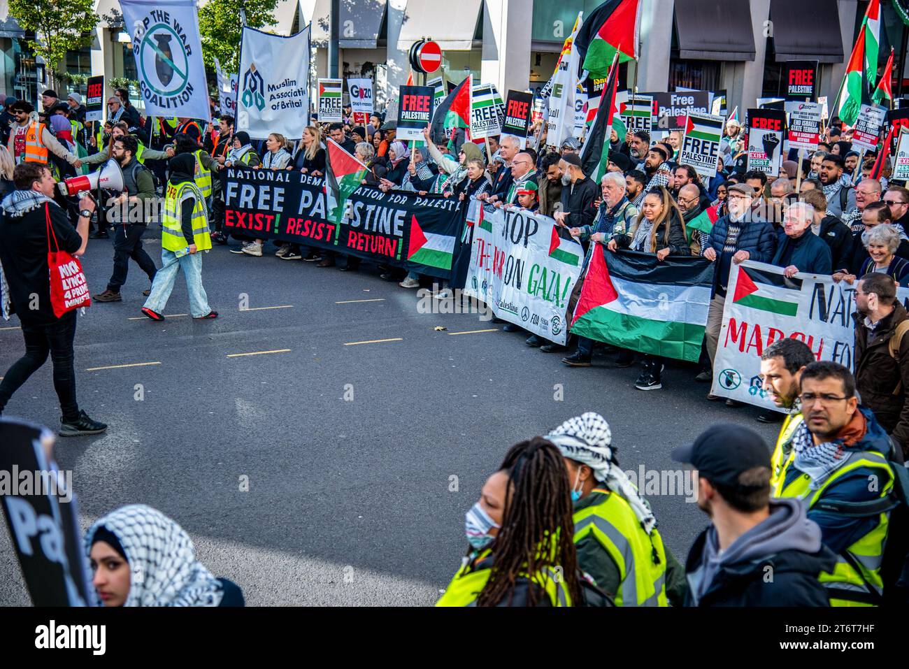 Crowds of protestors march with large banners during the National March For Palestine Ceasefire Now! Protest. Organizers called for a ceasefire which is rooted in a sincere wish to see an end to all violence, especially that which targets civilians while recognizing that this cannot be achieved unless the root causes of that violence, the 75 years of ongoing Nakba against the Palestinian people, are adequately addressed. (Photo by Loredana Sangiuliano / SOPA Images/Sipa USA) Stock Photo