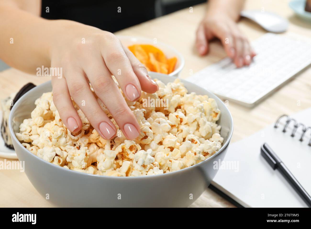 Bad habits woman eating hi-res stock photography and images - Alamy