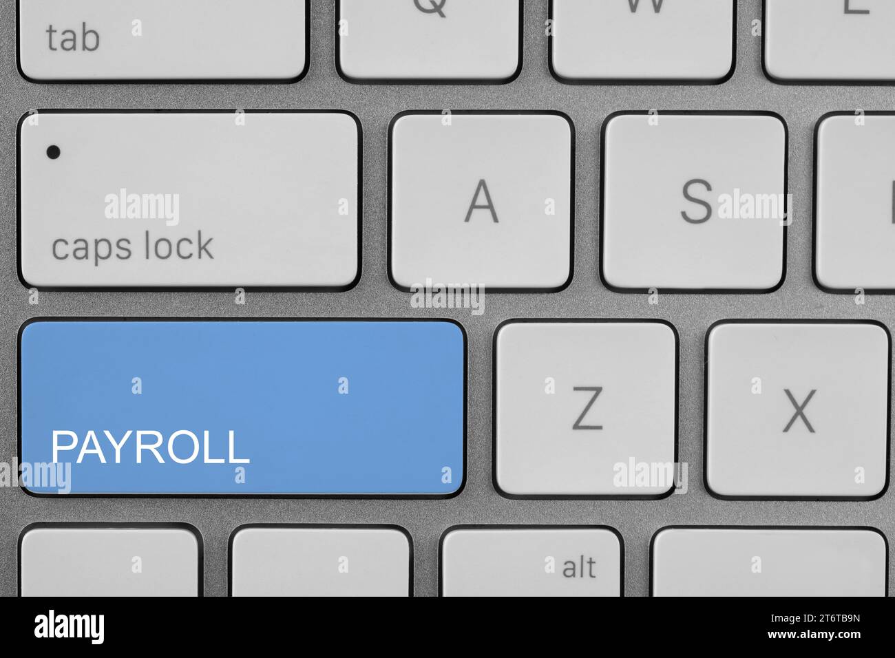 Light blue button with word Payroll on keyboard, top view Stock Photo