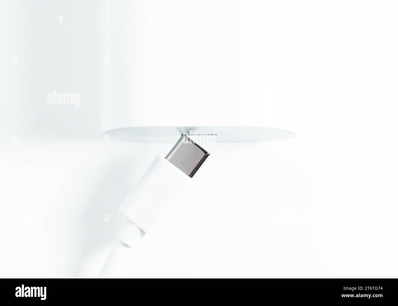 Charger and USB Type-C cable on white background Stock Photo
