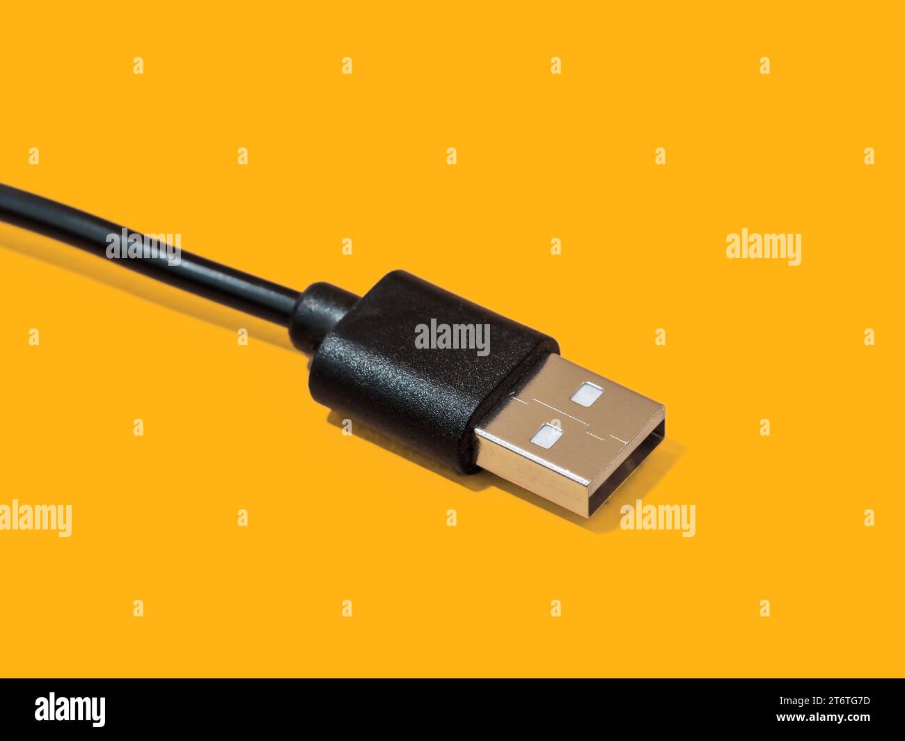 Micro USB cable close-up on yellow background Stock Photo