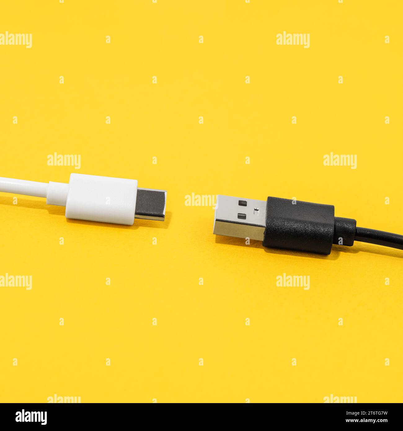 USB cable, type C cable over yellow background Stock Photo