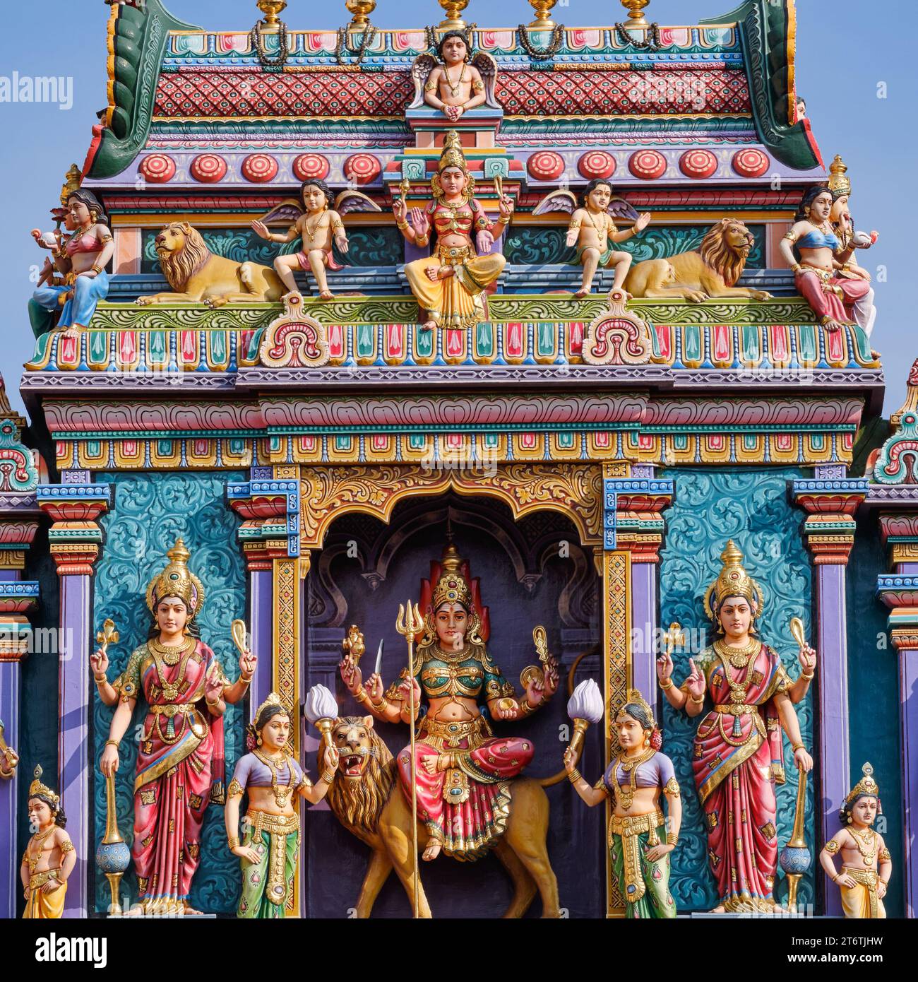 The top of the gopuram (entrance tower) of Sri Vadapathira Kaliammam Temple, with colorful figures of Hindu deities; Little India, Singapore Stock Photo