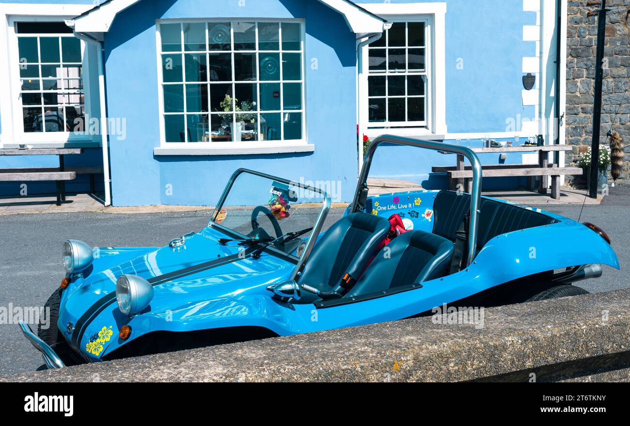 A VW Beach buggy is parked by the beach in Aberaeon in West Wales UK Stock Photo