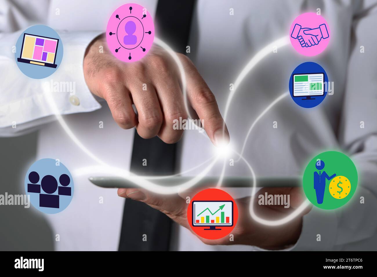 Marketing strategy. Man using tablet computer, closeup. Different virtual icons appearing before touch Stock Photo