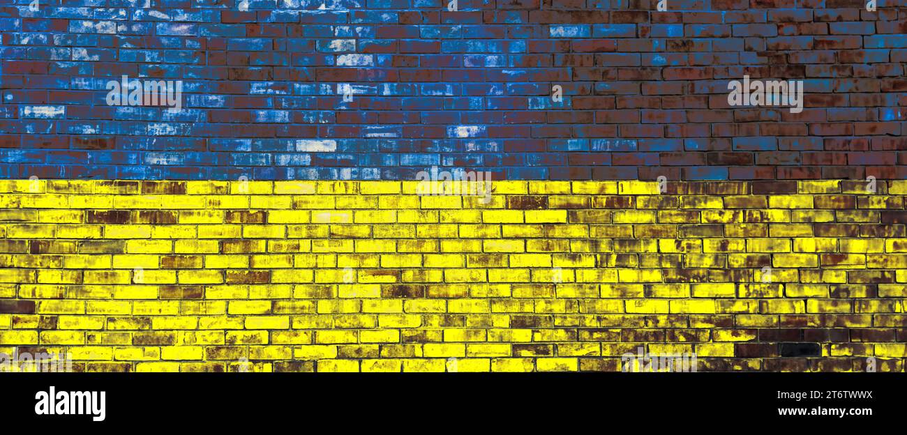 National flag of Ukraine painted on brick wall, banner design Stock Photo