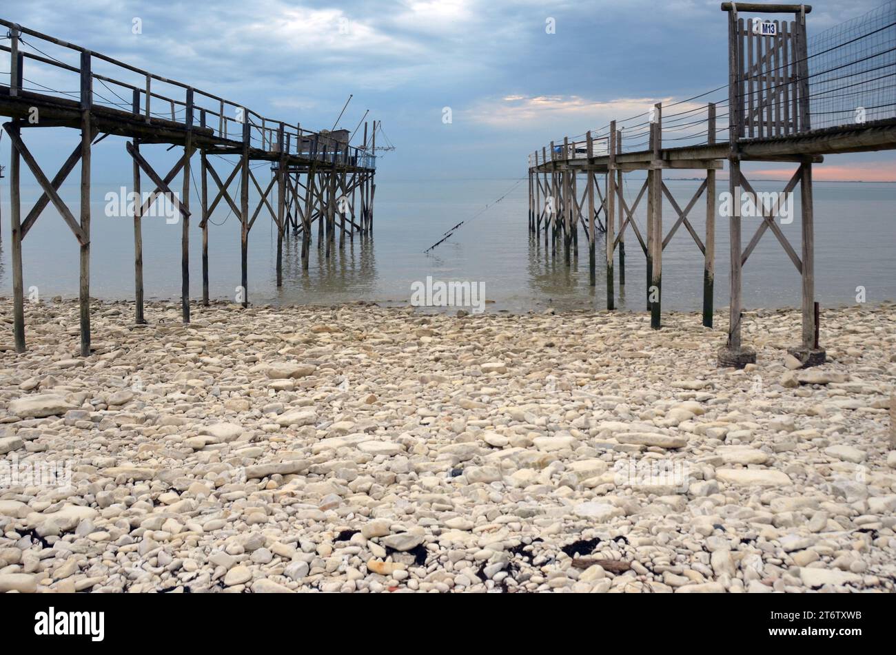 Along the atlantic coastline of the Vendée region in France are numerous fishing structures on stilt, they're called pêche au carrelet. Stock Photo