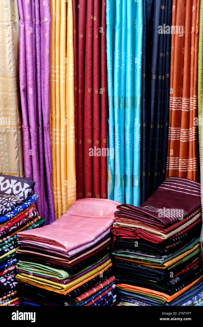 Saree Stack Fancy Indian sarees, Neatly stacked colorful silk saris in racks in a ...
