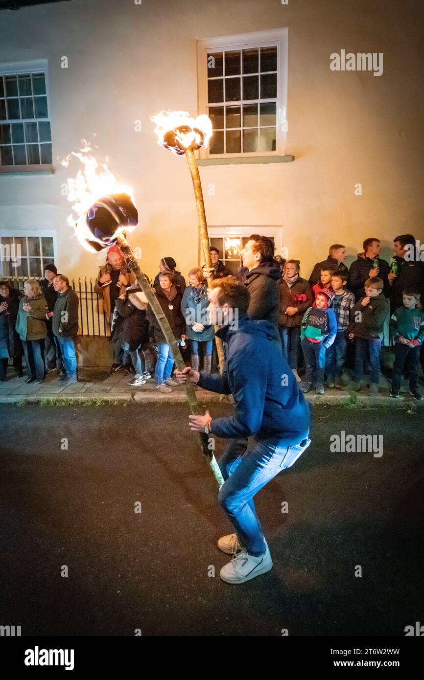 Hatherleigh, UK. , . Flaming parade in the Hatherleigh Carnival & Tar Barrels at night in Devon. Credit: Thomas Faull/Alamy Live News Stock Photo