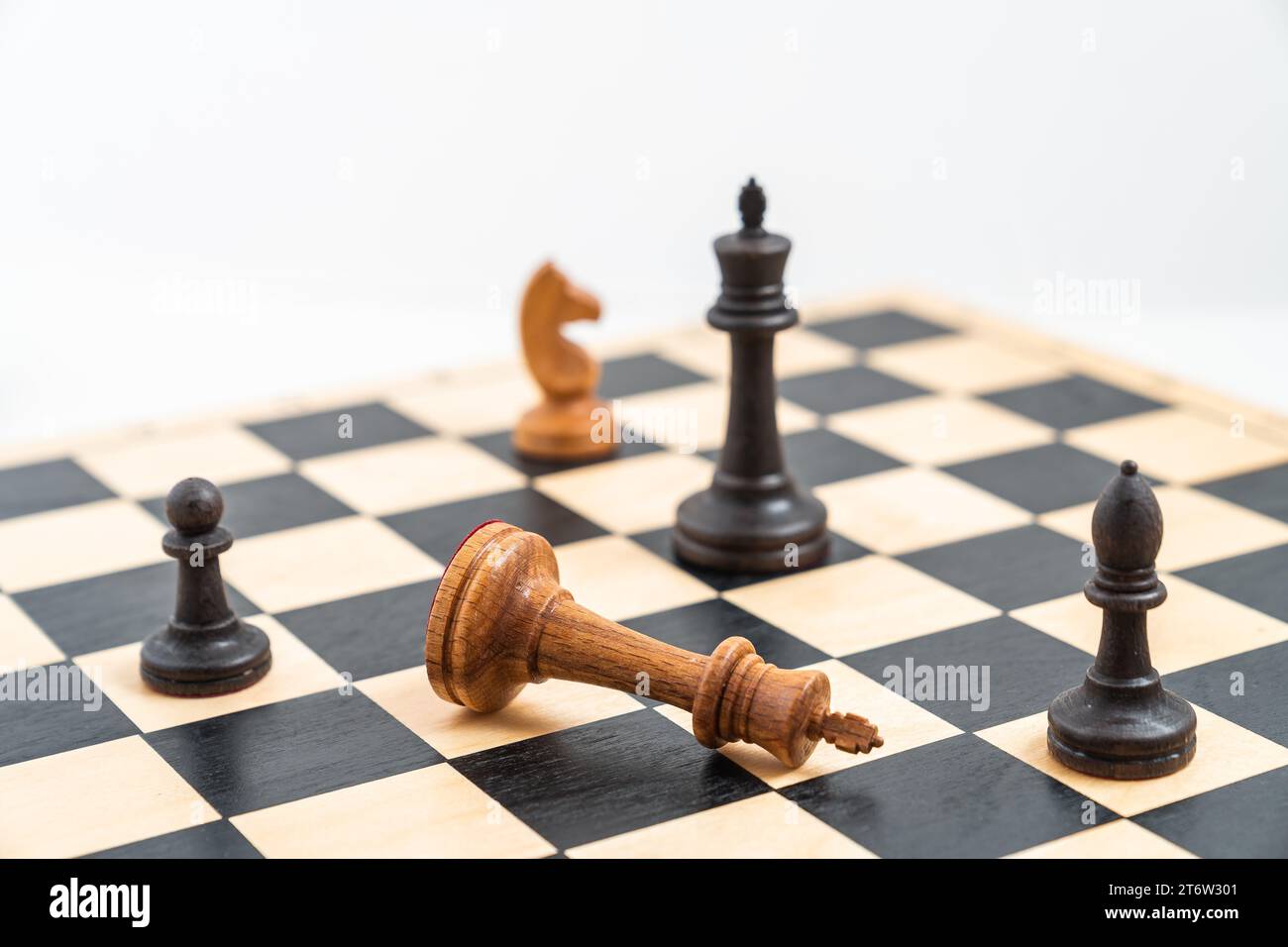 Chess game with black and white pieces on the chessboard. White king