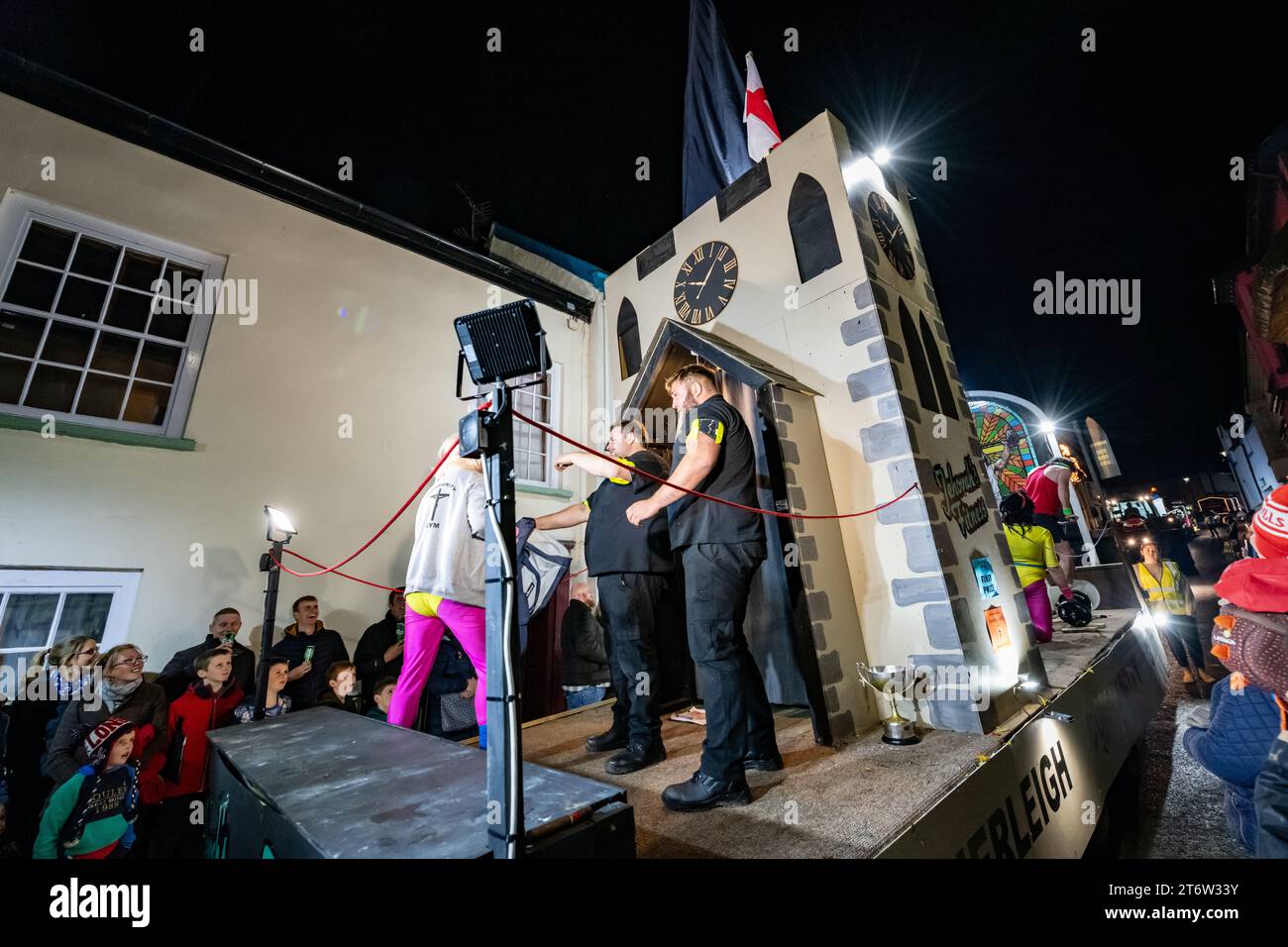 Hatherleigh, UK. 11 Novmeber 2023. Colourful parade floats in the Hatherleigh Carnival & Tar Barrels at night in Devon. Stock Photo