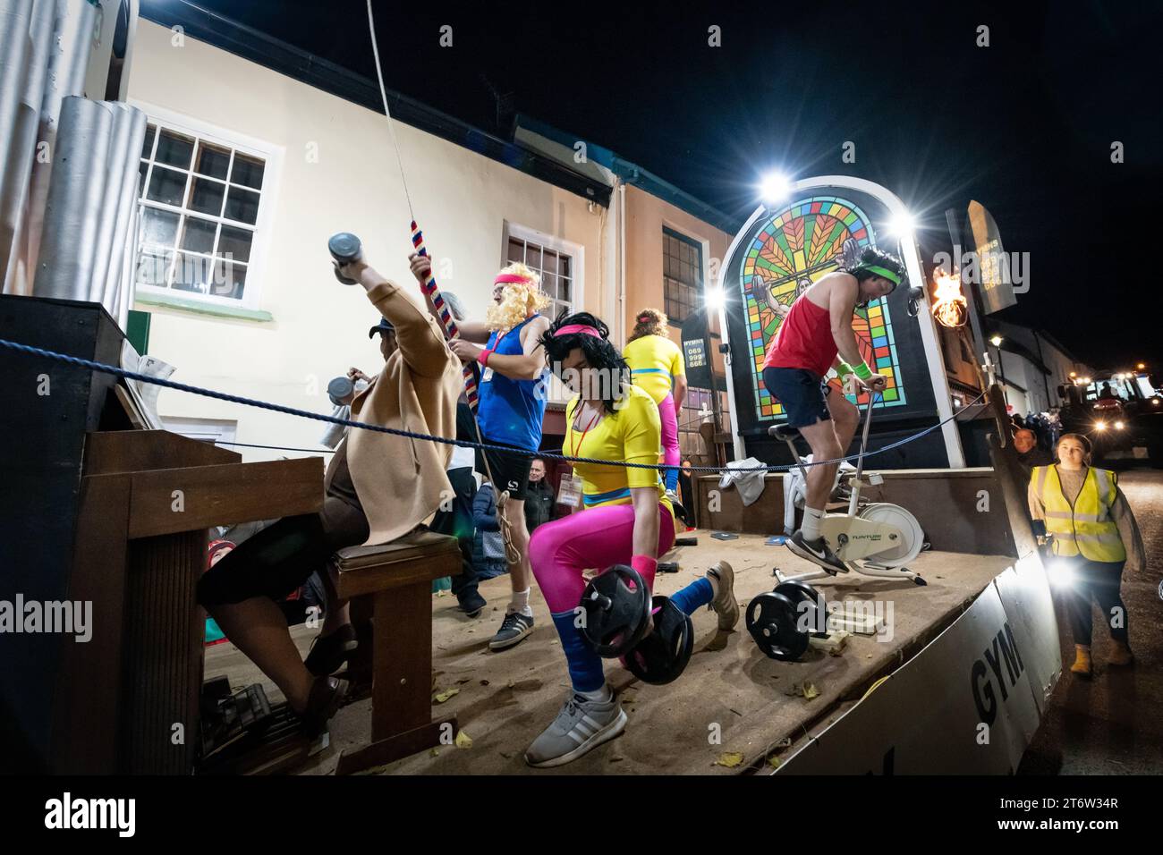 Hatherleigh, UK. 11 Novmeber 2023. Colourful parade floats in the Hatherleigh Carnival & Tar Barrels at night in Devon. Stock Photo