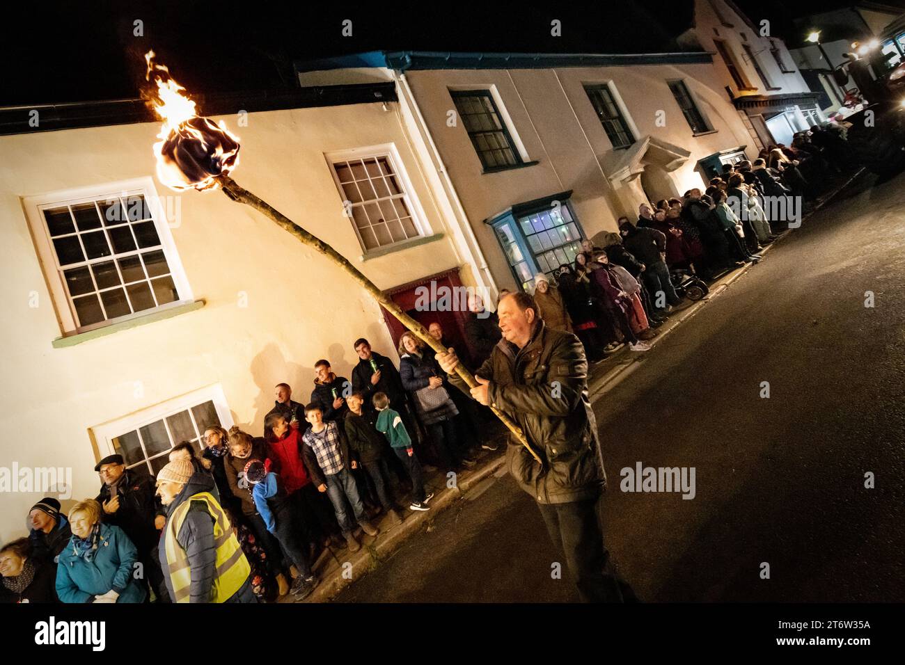 Hatherleigh, UK. 11 Novmeber 2023. Flaming parade in the Hatherleigh Carnival & Tar Barrels at night in Devon. Stock Photo