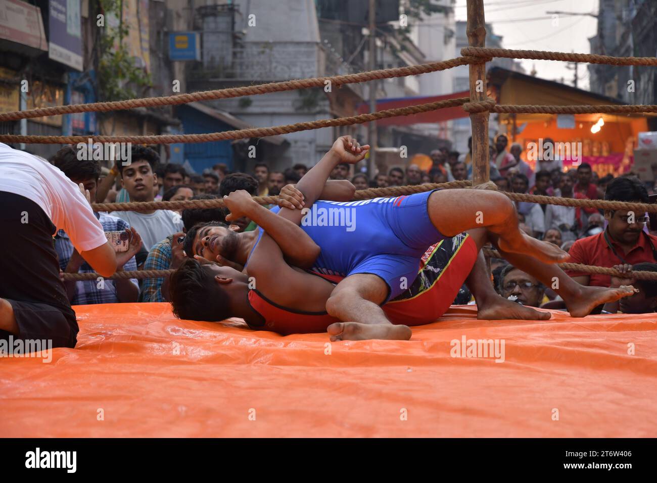 Wrestlers participate in an openair street wrestling competition named