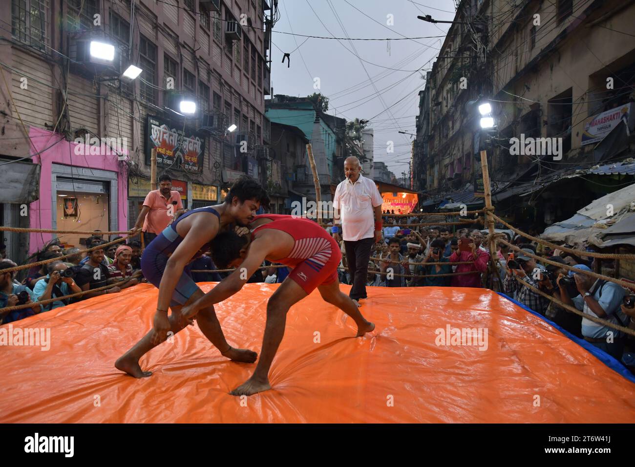 Wrestlers participate in an openair street wrestling competition named