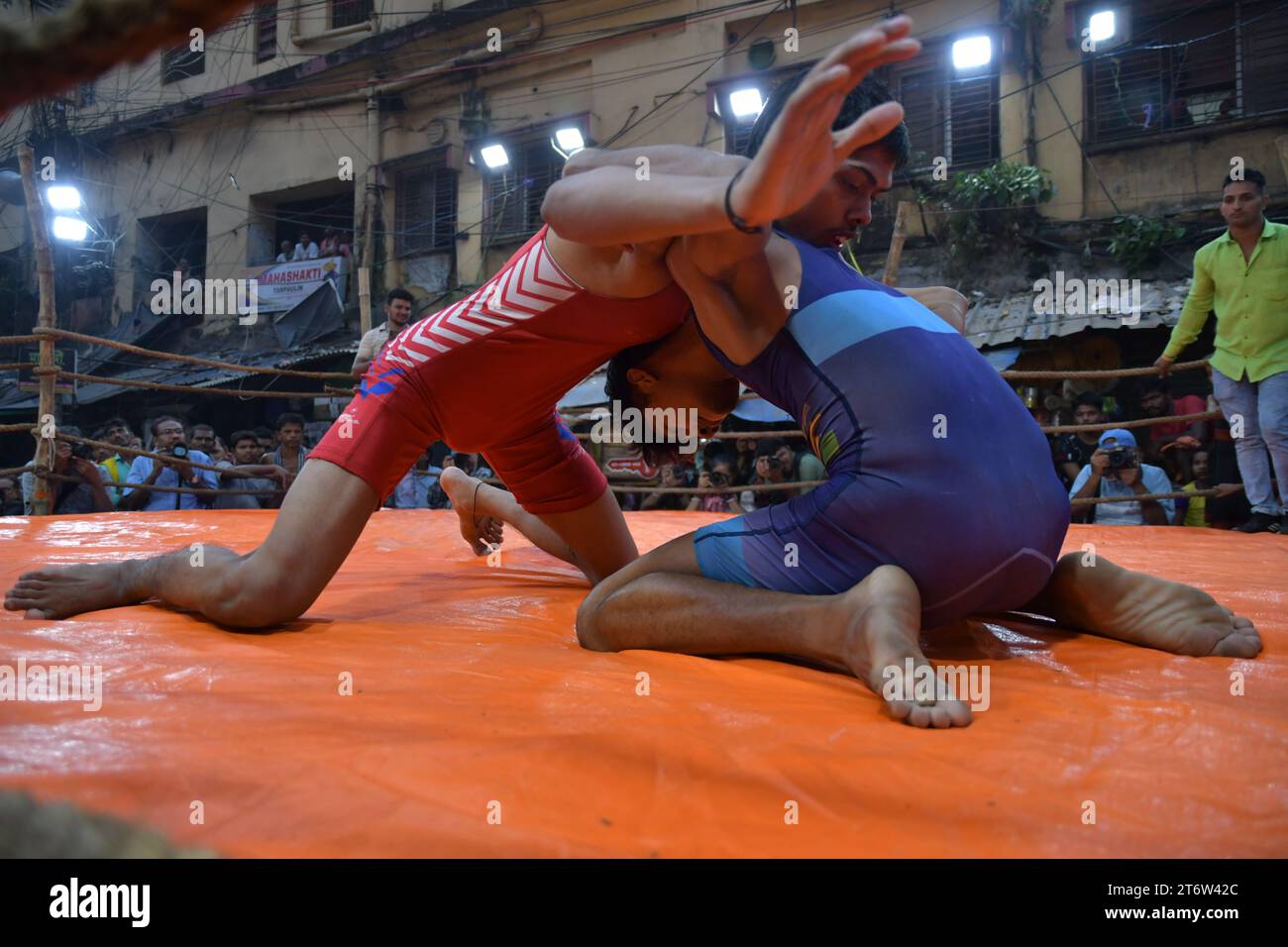 Wrestlers participate in an openair street wrestling competition named