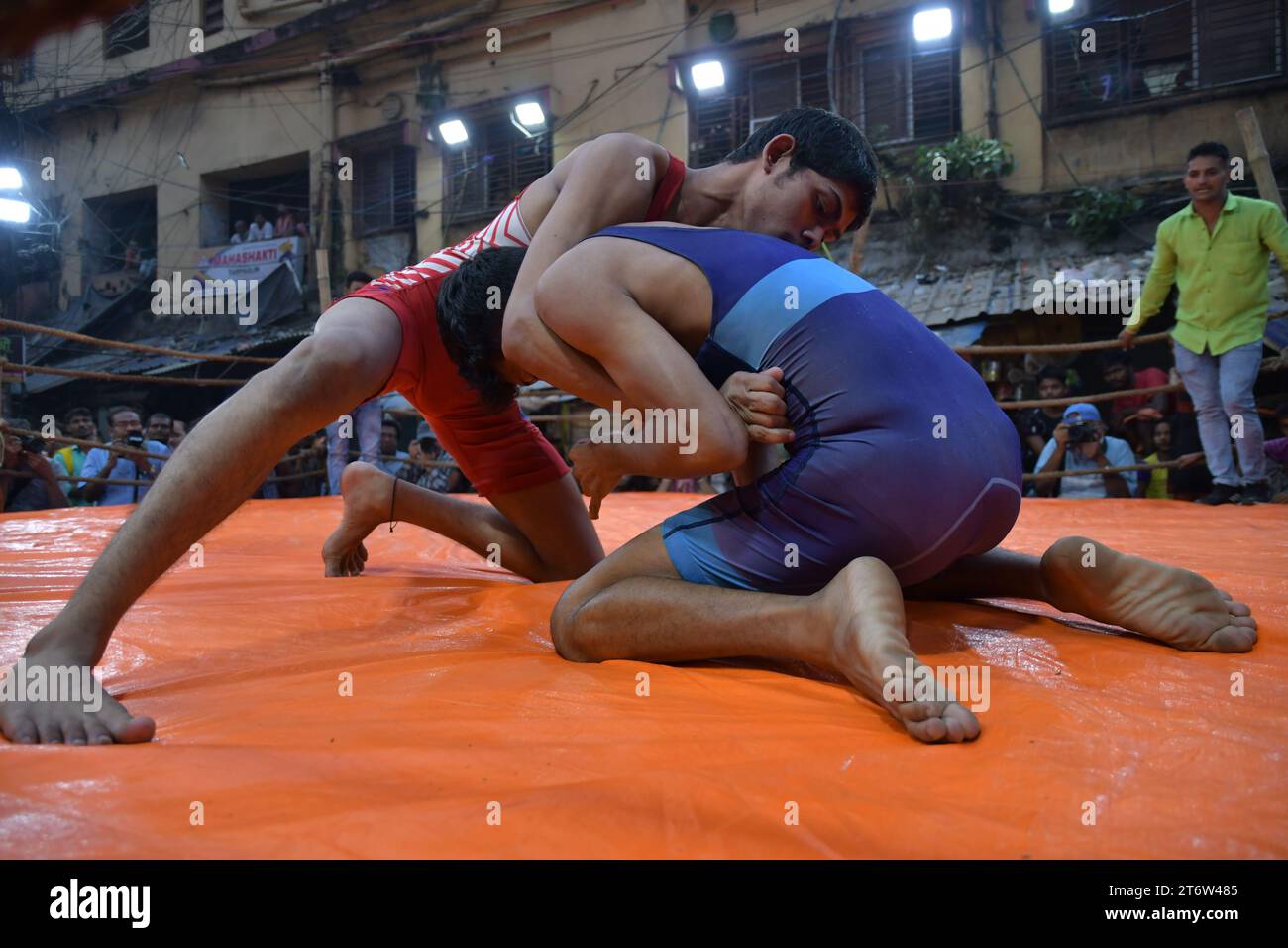 Wrestlers participate in an openair street wrestling competition named