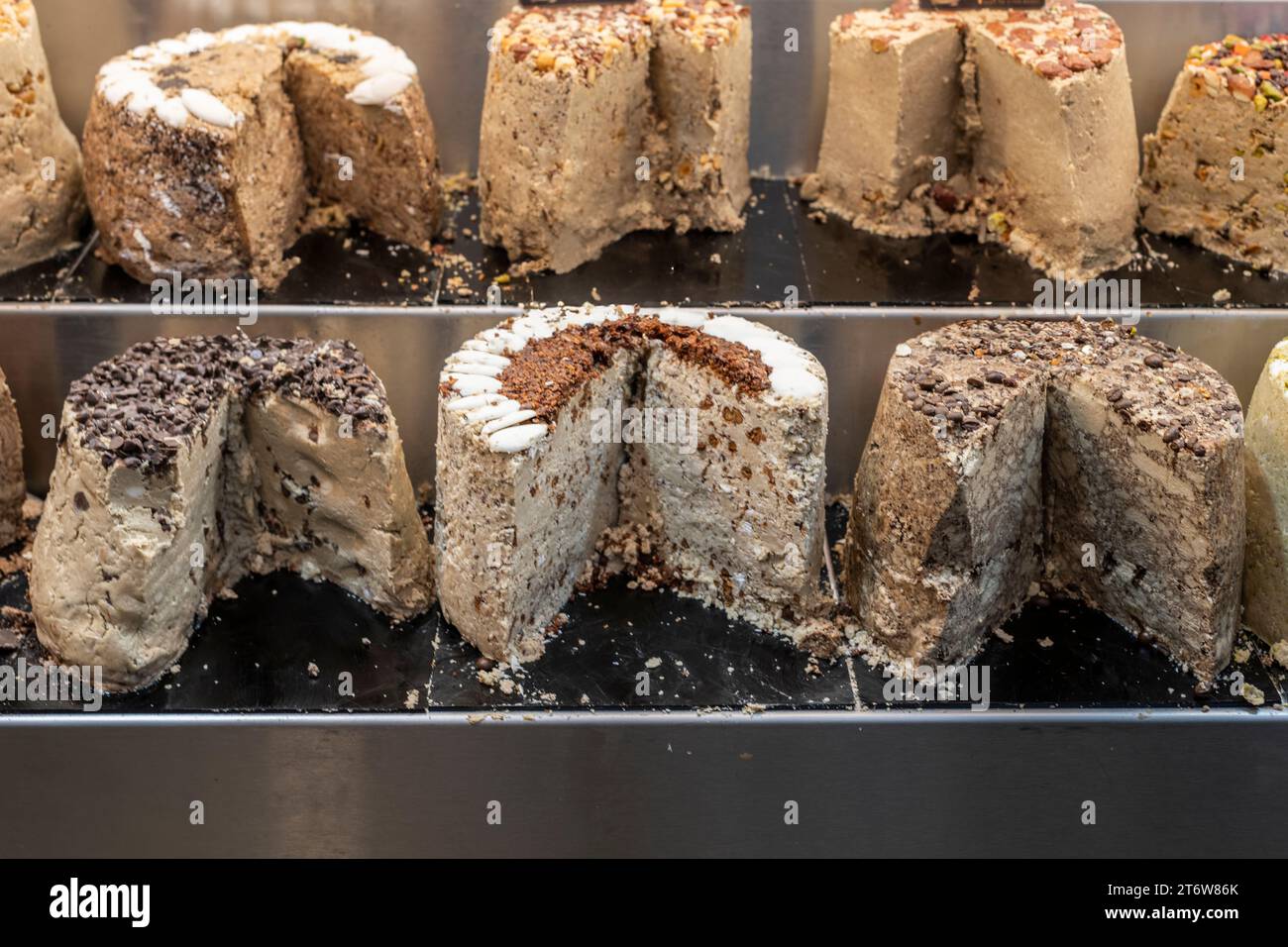 A selection of specially-flavored halva or sesame candy cakes, a Middle Eastern treat, on sale in Jerusalem's Machane Yehuda market. Stock Photo
