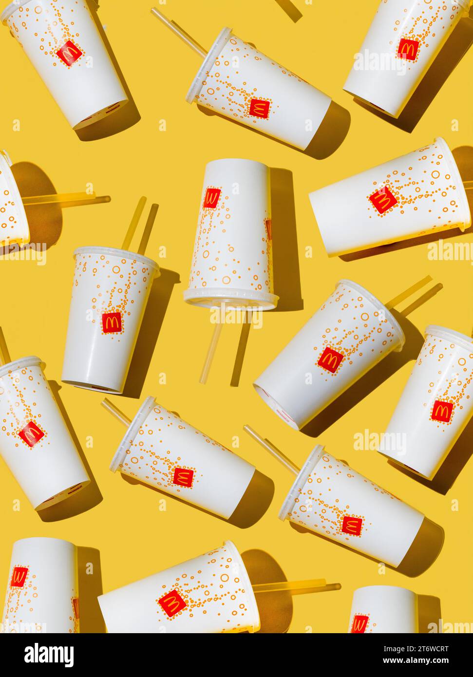 Yellow glass of McDonald's. Paper cup with lid. Takeaway drink ...