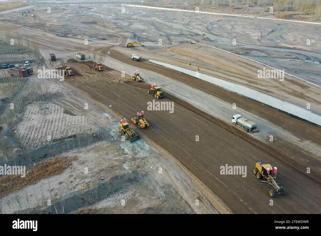(231112) -- KASHGAR, Nov. 12, 2023 (Xinhua) -- This aerial photo taken on Nov. 8, 2023 shows a construction site of a section of the G315 highway linking Tuopa Village and the Torugart port, northwest China's Xinjiang Uygur Autonomous Region.  The Kashgar Prefecture, which enjoys unique geographical advantages, serves as a gateway for opening up, connecting China with Central Asia, South Asia, West Asia and Europe.    Through favorable policies, improved infrastructure, and the promotion of cross-border exchanges, the prefecture has witnessed rapid development. In the first three quarters of t Stock Photo