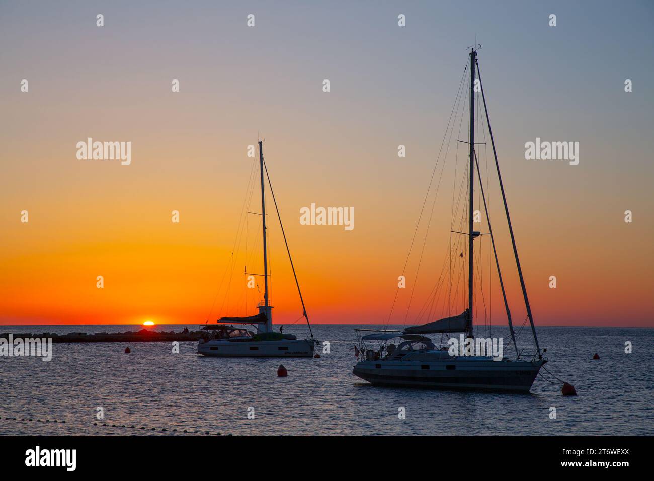 Sunset, Anchored Sailboats, Old Town, Novigrad, Croatia Stock Photo