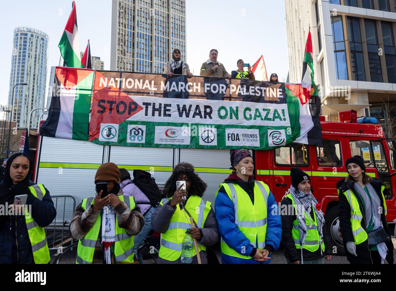 London, UK. 11th November, 2023. ProPalestinian protesters stand on