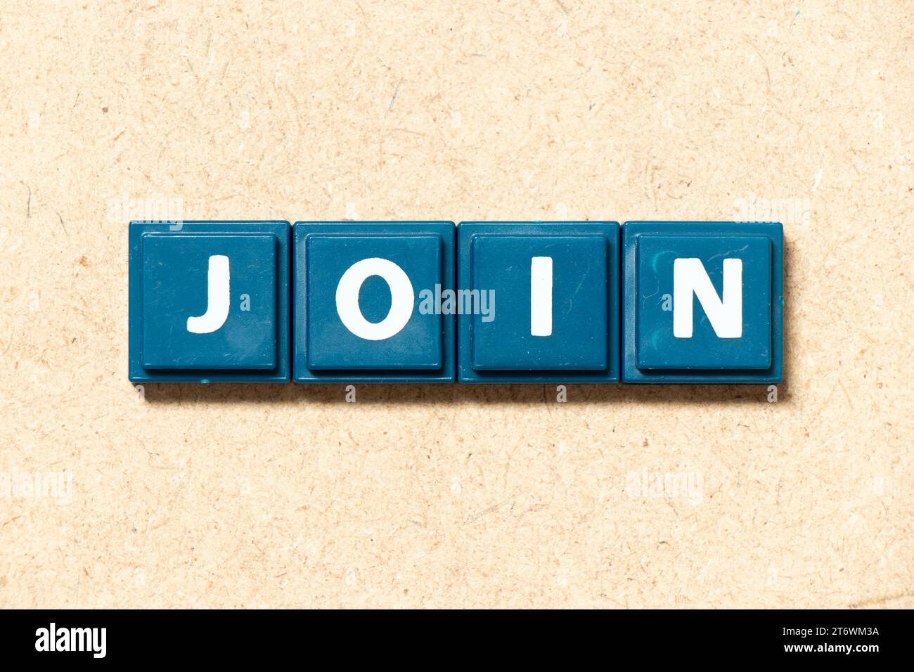 Tile alphabet letter in word join on wood background Stock Photo - Alamy