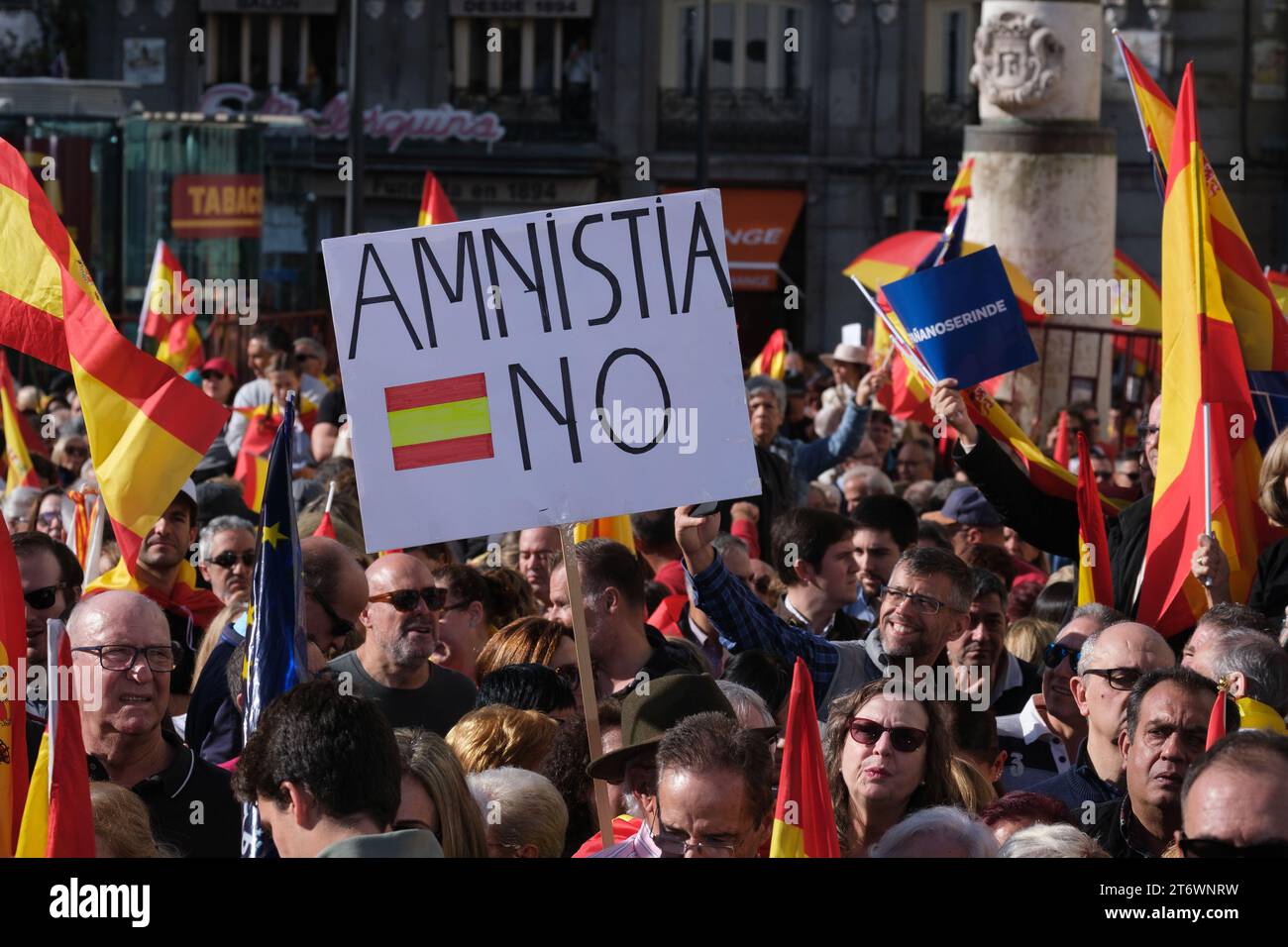 Right-wing protesters protest during a demonstration against the amnesty for Catalan separatists and against Pedro Sanchez in Puerta de Sol in Madrid, Stock Photo