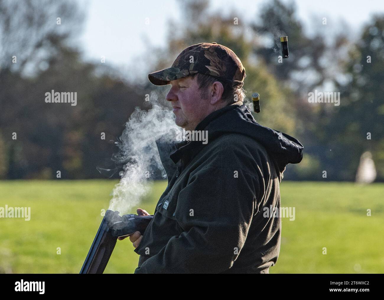Cartridges leaving a shotgun during a private shoot in Cheshire Stock Photo