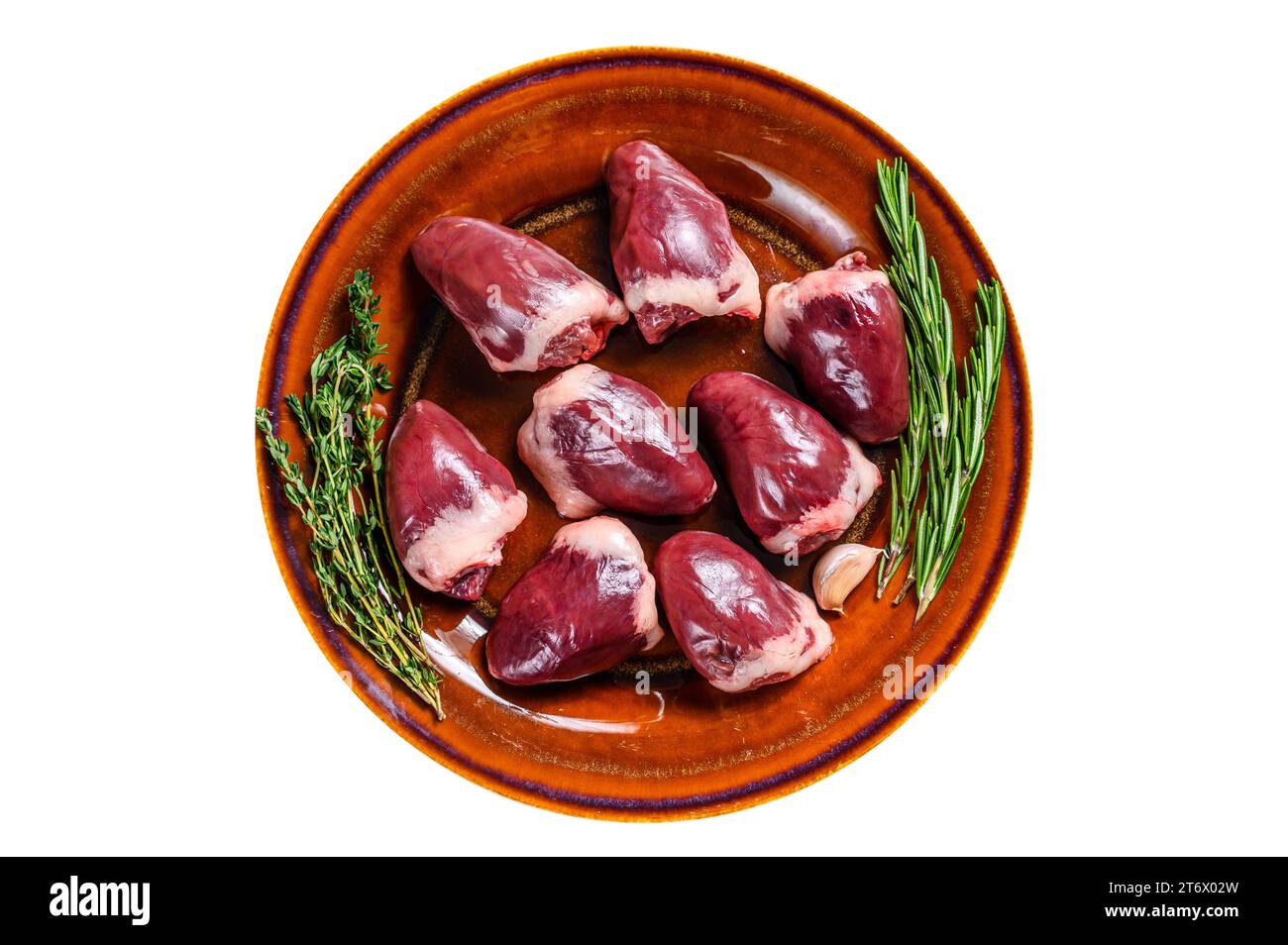 Fresh Raw turkey hearts offal giblets with thyme and rosemary. Isolated