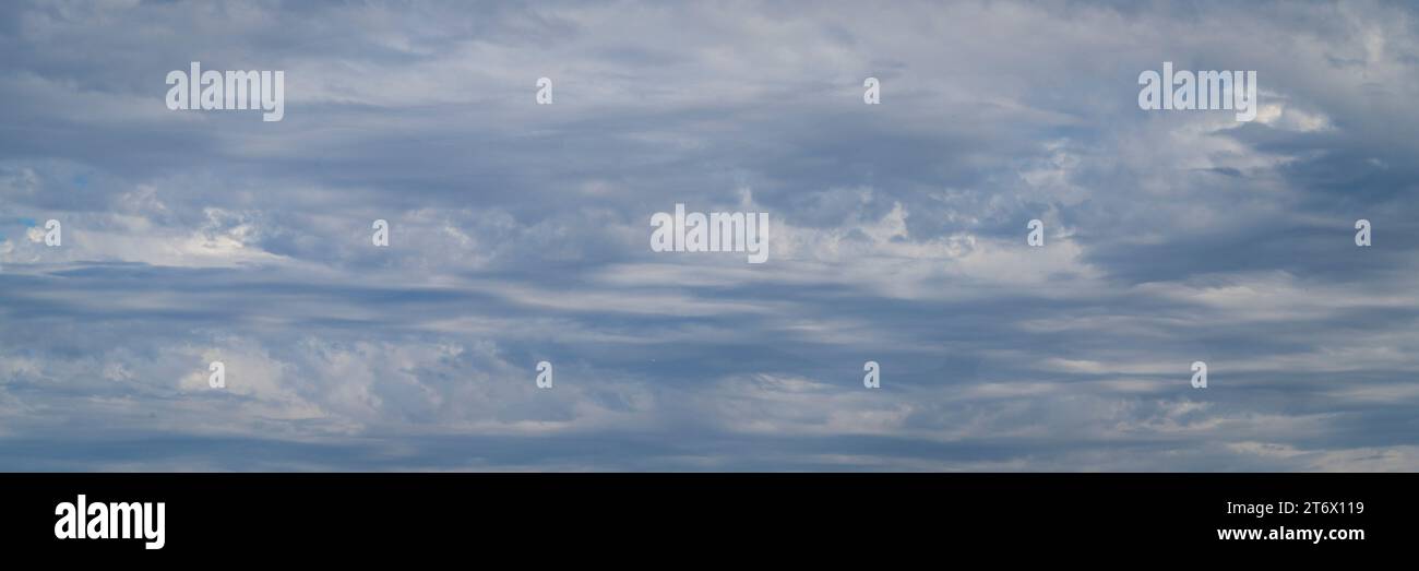 gray sky with stormy dramatic clouds - panorama Stock Photo
